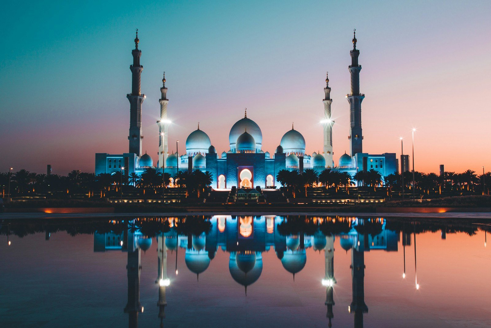Sheikh Zayed Grand Mosque reflected at sunset in Abu Dhabi